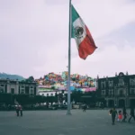 people near mexican flag